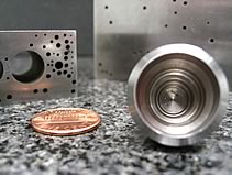 Sample die blocks and prototype nozzles that were EDM hole burned using the small hole EDM process at MILCO Wire EDM